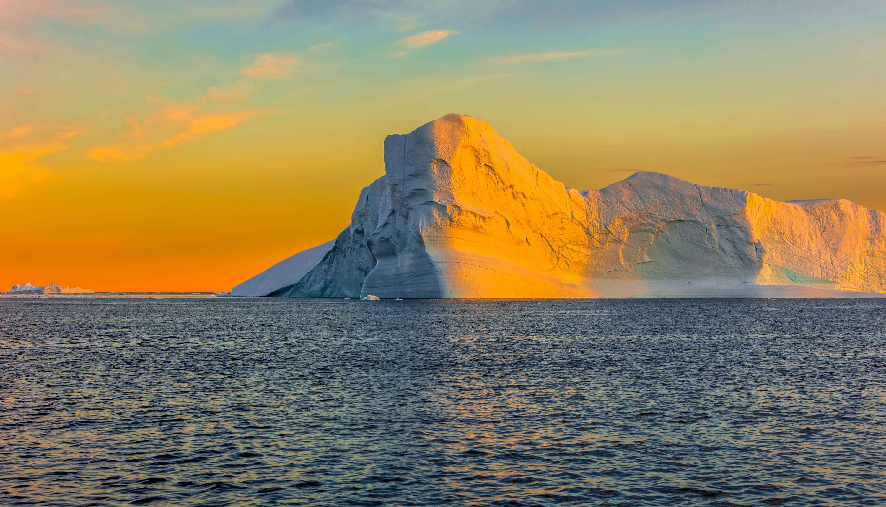 Image of sunlight hitting the side of a large iceberg