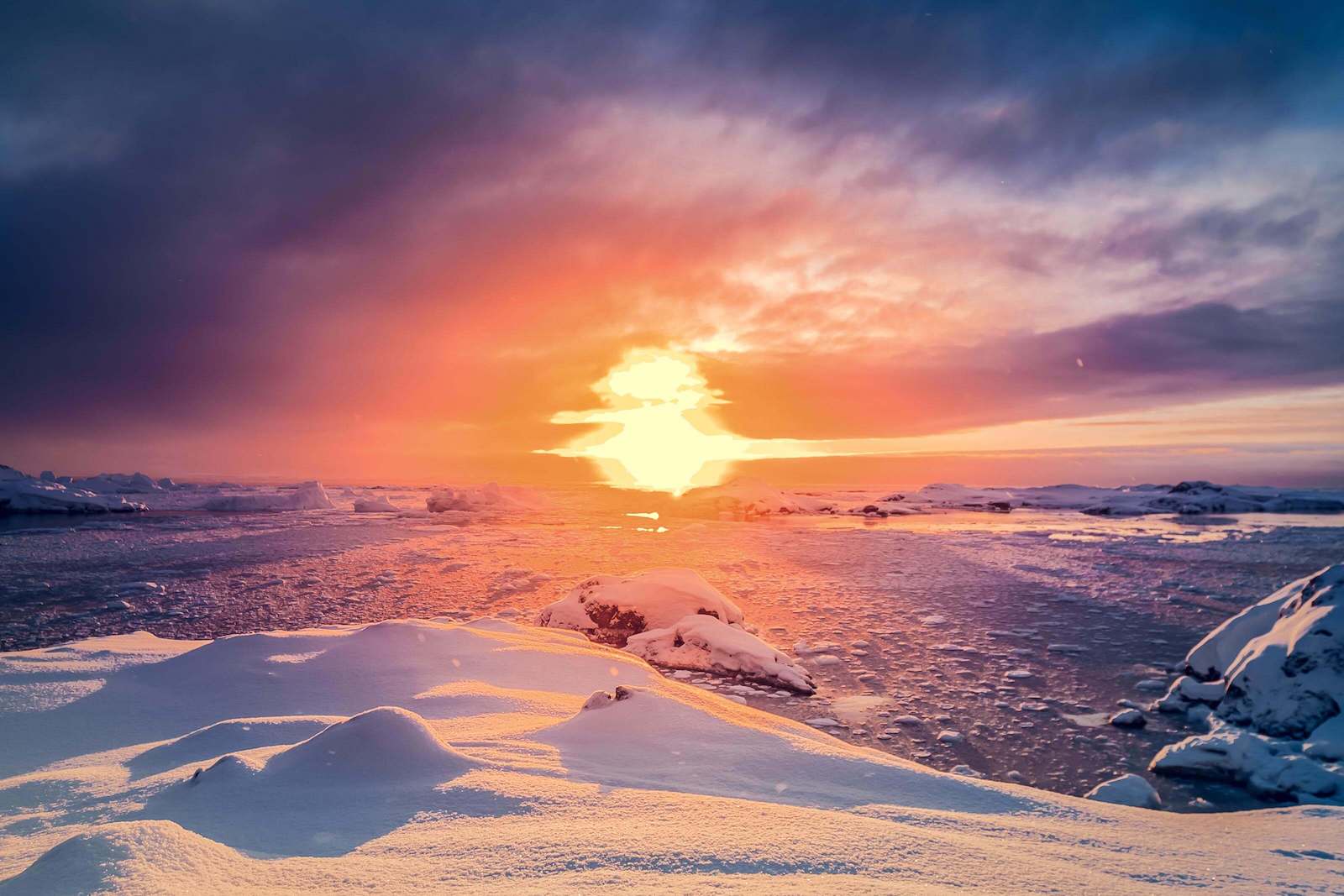 Image of sun setting over arctic landscape